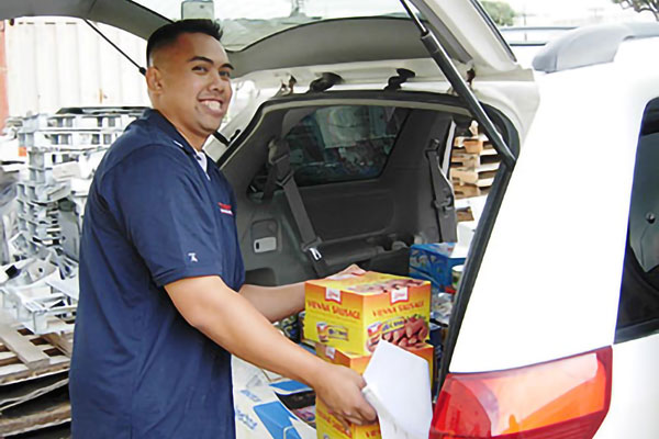 Preparing donations into a dinner for the families.